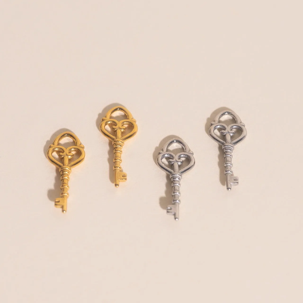 Key Heart Huggie Hoop Charms sold by Modcloth