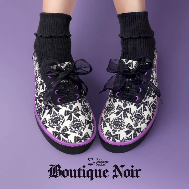 Chocolaticas® Bowtique Noir Casual Sneaker sold by Modcloth