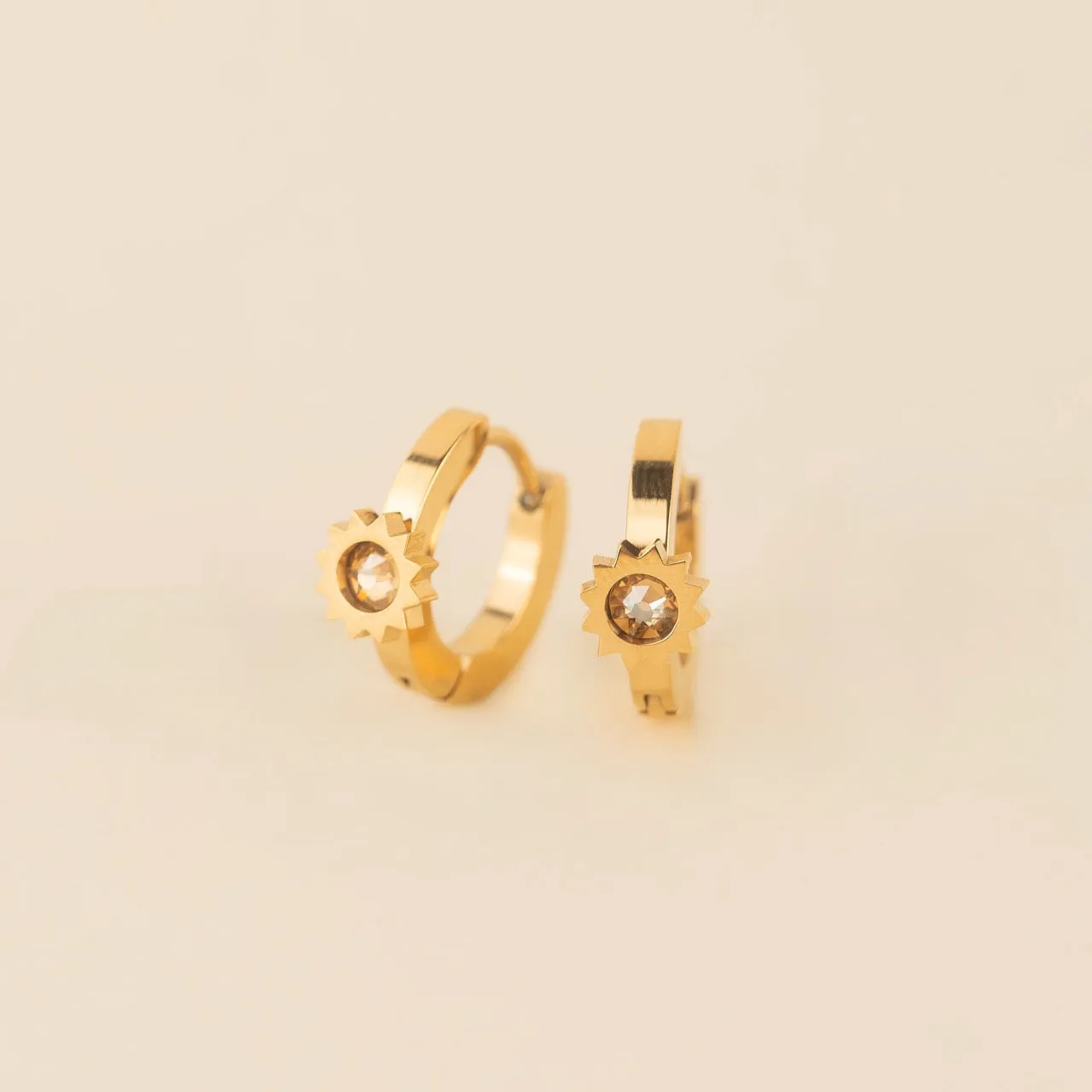 Sun 3D Huggie Hoop Earrings sold by Modcloth