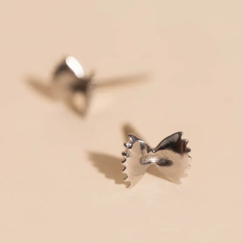 Bowtie Stud Earrings sold by Modcloth