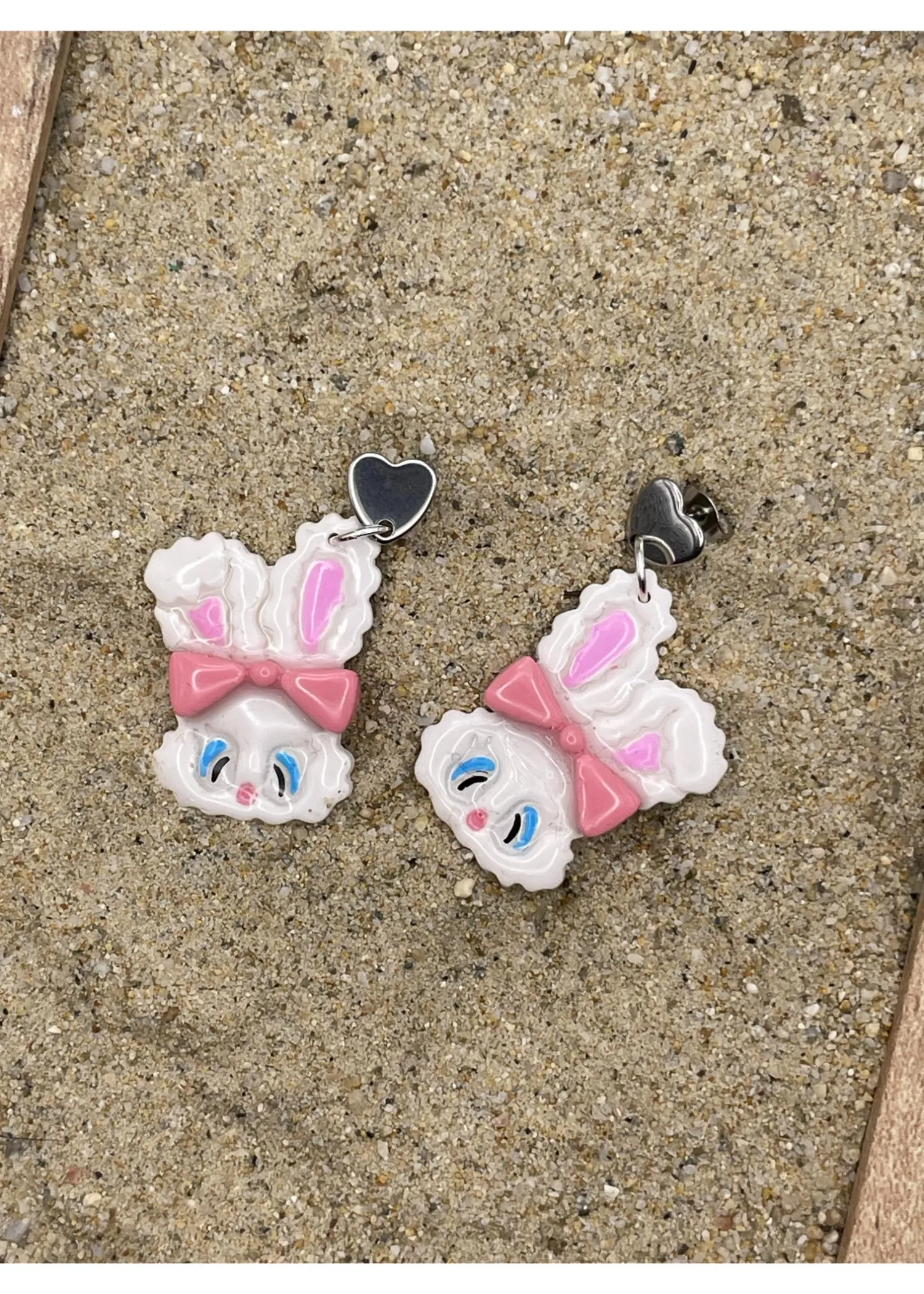 White Fluffy Easter Bunny Earrings with Pink Bow sold by Modcloth