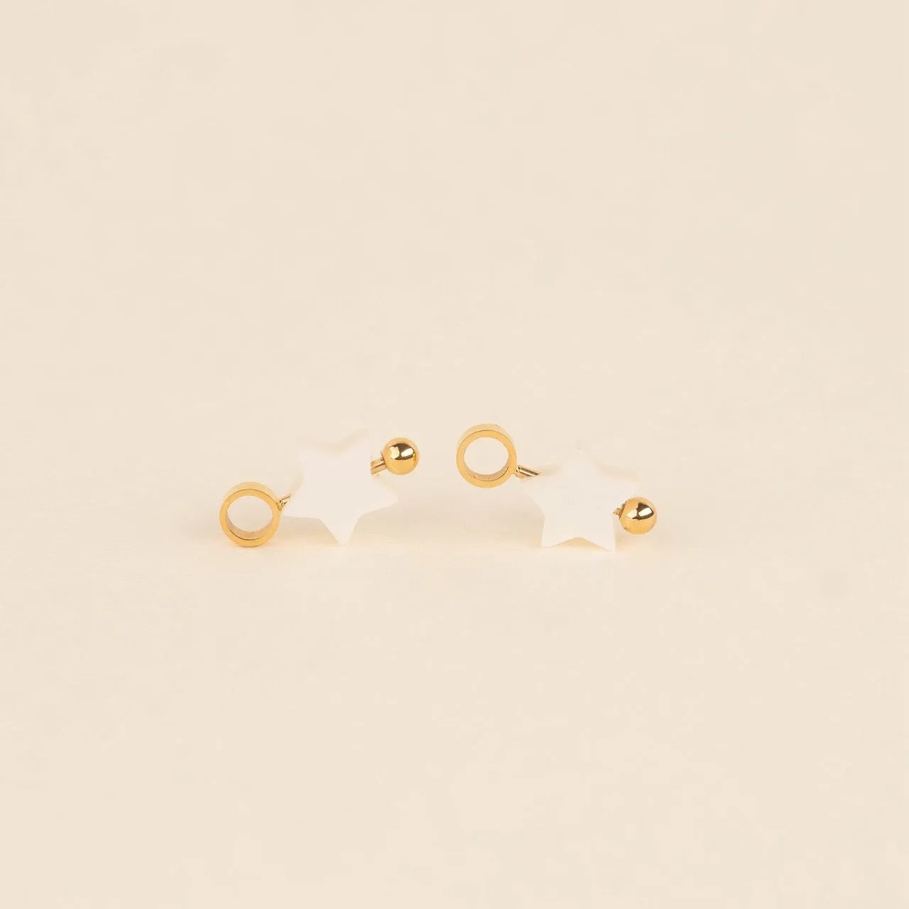 Iridescent Bead Star Huggie Hoop Charms sold by Modcloth