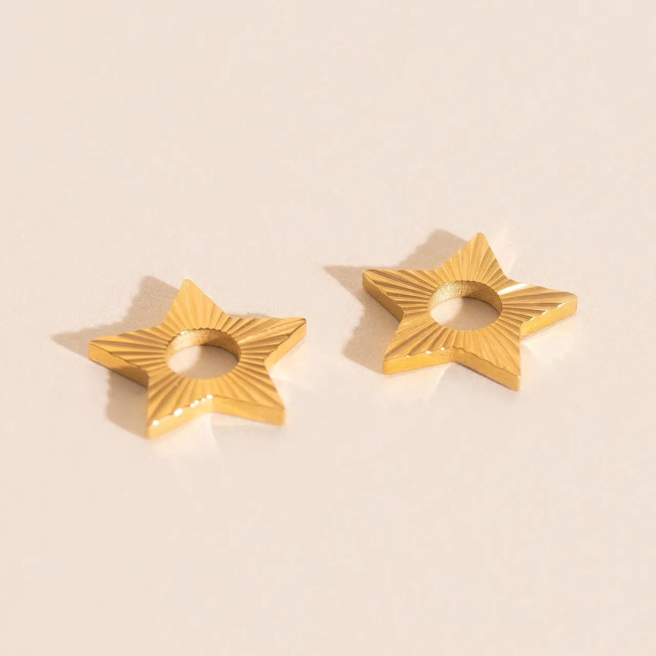 Winter Star Chunky Huggie Hoop Charms sold by Modcloth