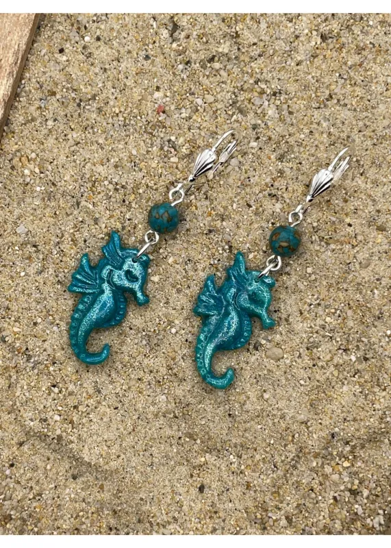 Shimmer Seahorse Dangle Earrings sold by Modcloth