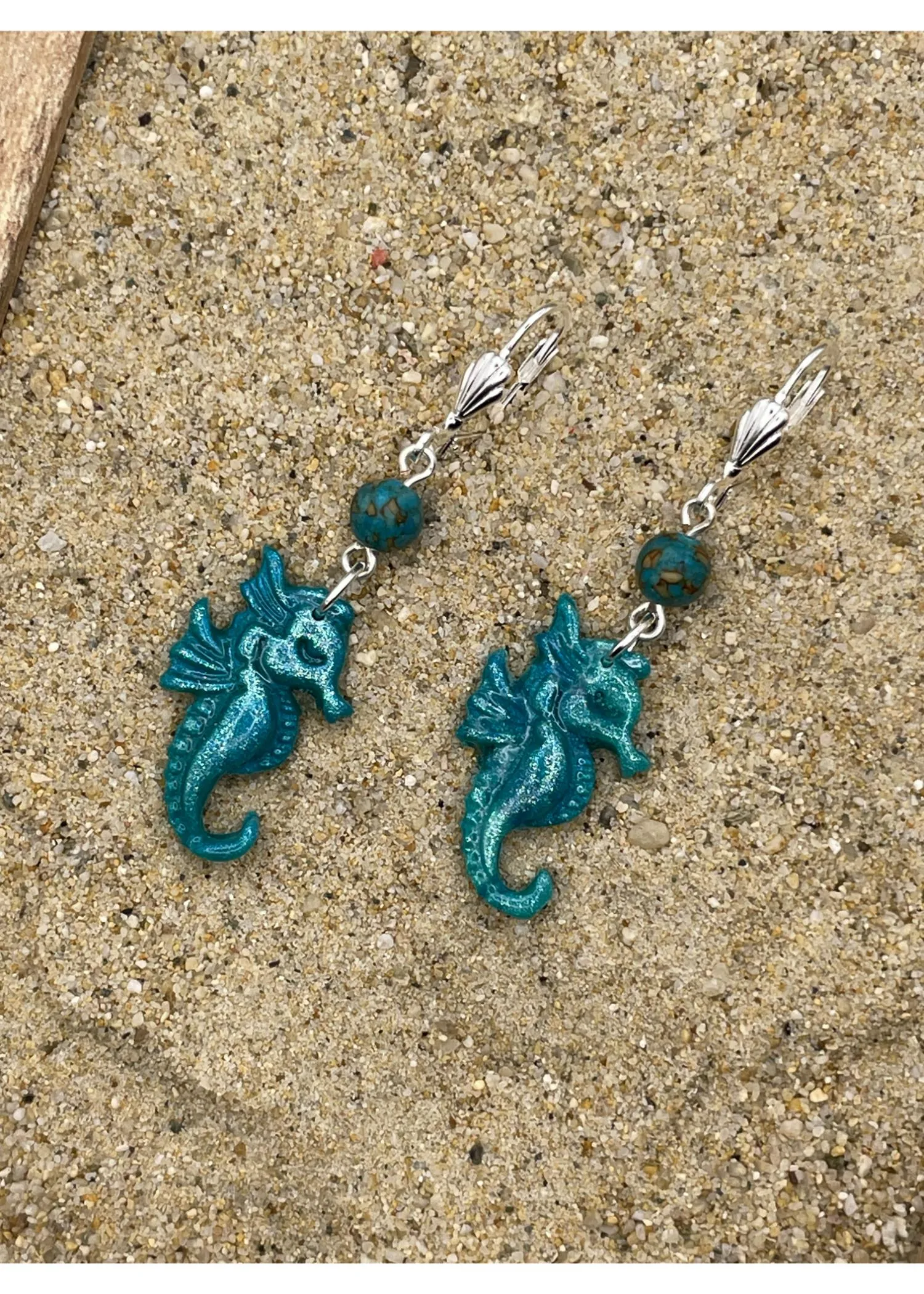 Shimmer Seahorse Dangle Earrings sold by Modcloth