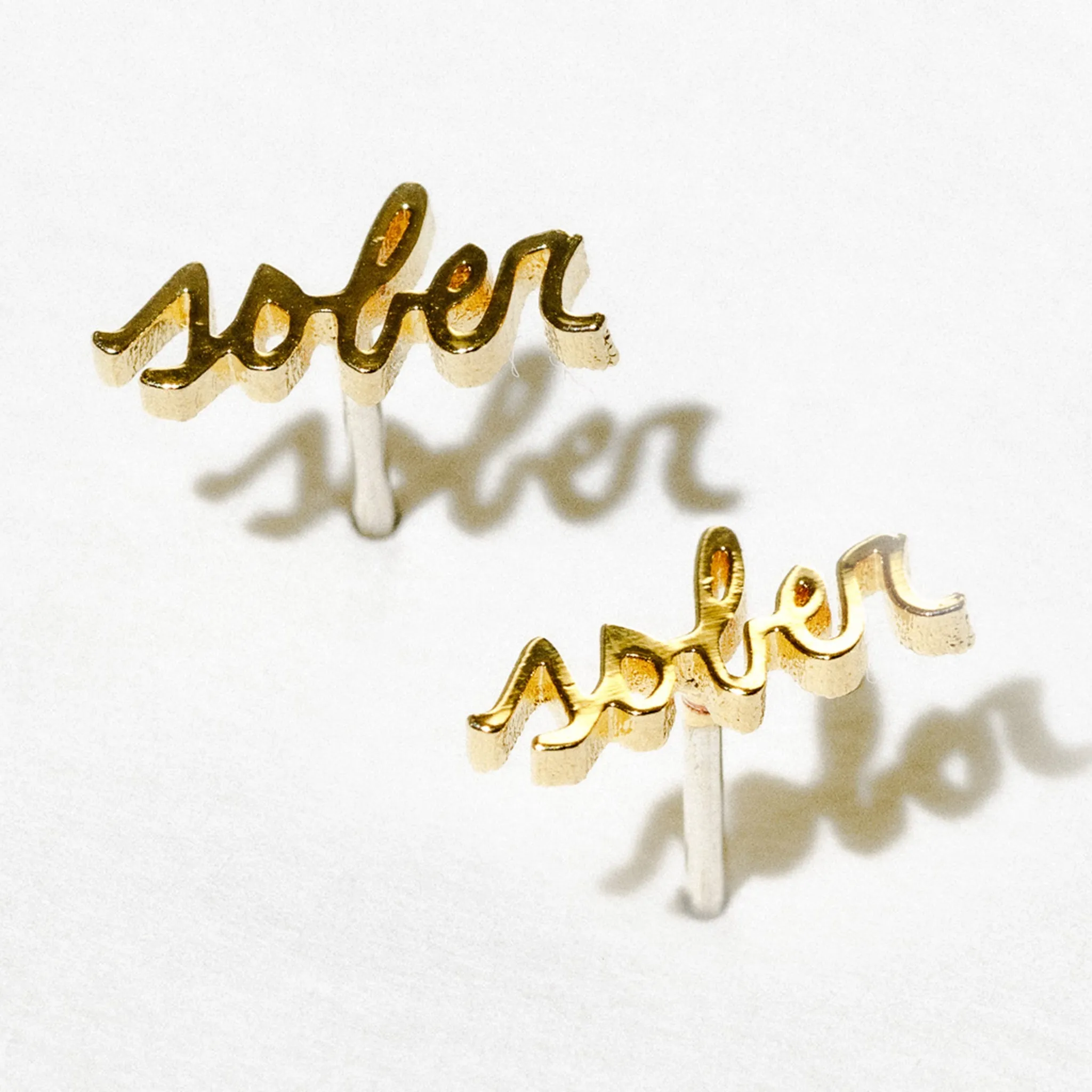 Tiny Sober Script Stud Earrings sold by Modcloth