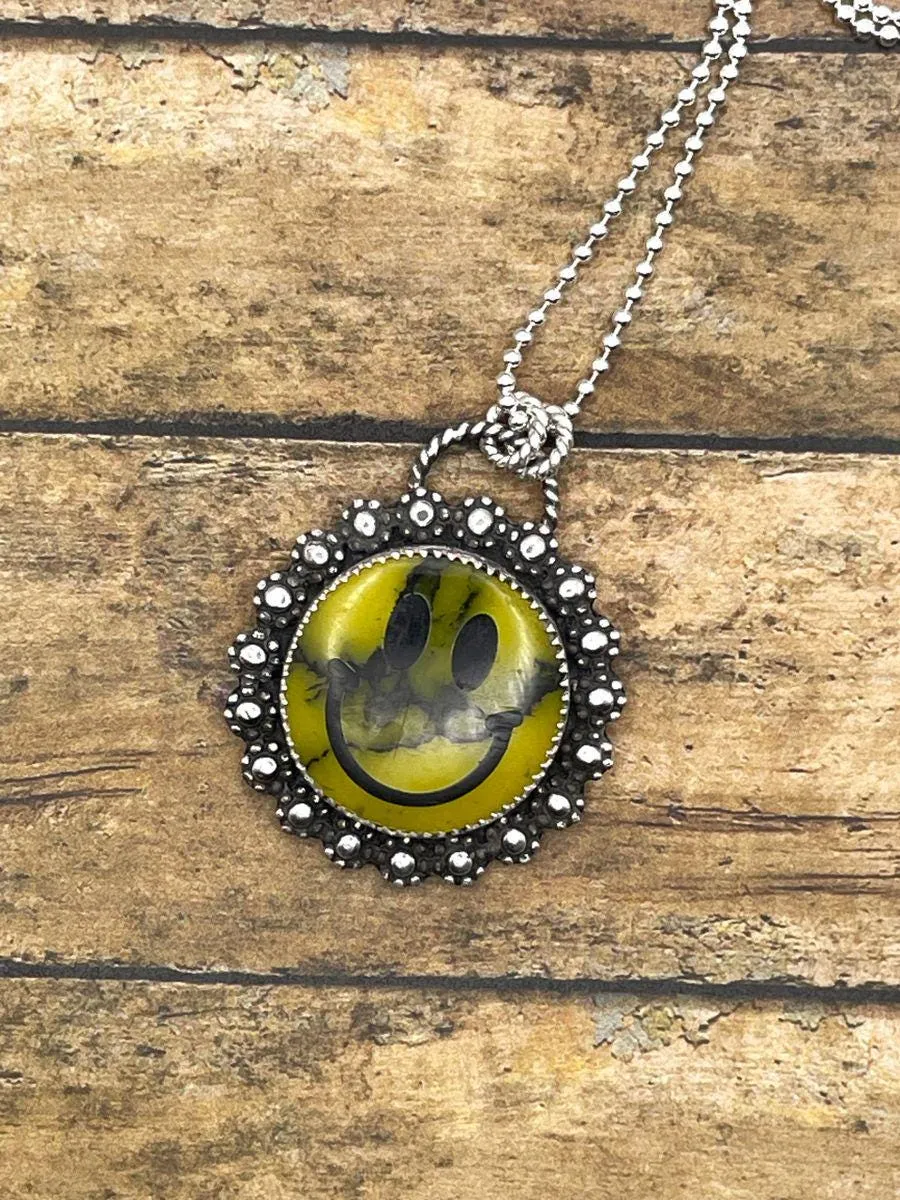 Quin - Smiley Face with Daisy Flowers Pendant Necklace sold by Modcloth