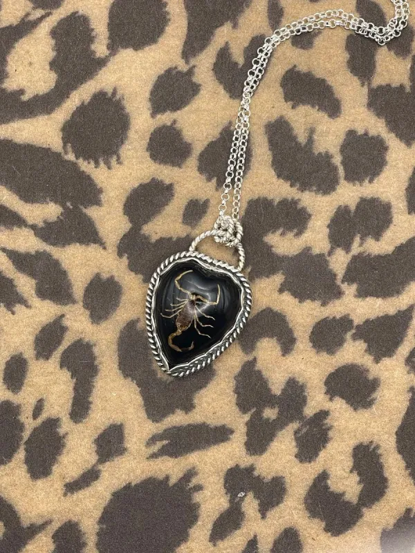 Warner - Golden Scorpion in Black Resin Heart Necklace made by Modcloth