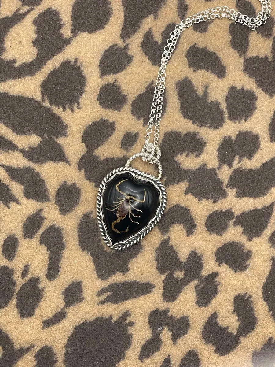 Warner - Golden Scorpion in Black Resin Heart Necklace sold by Modcloth