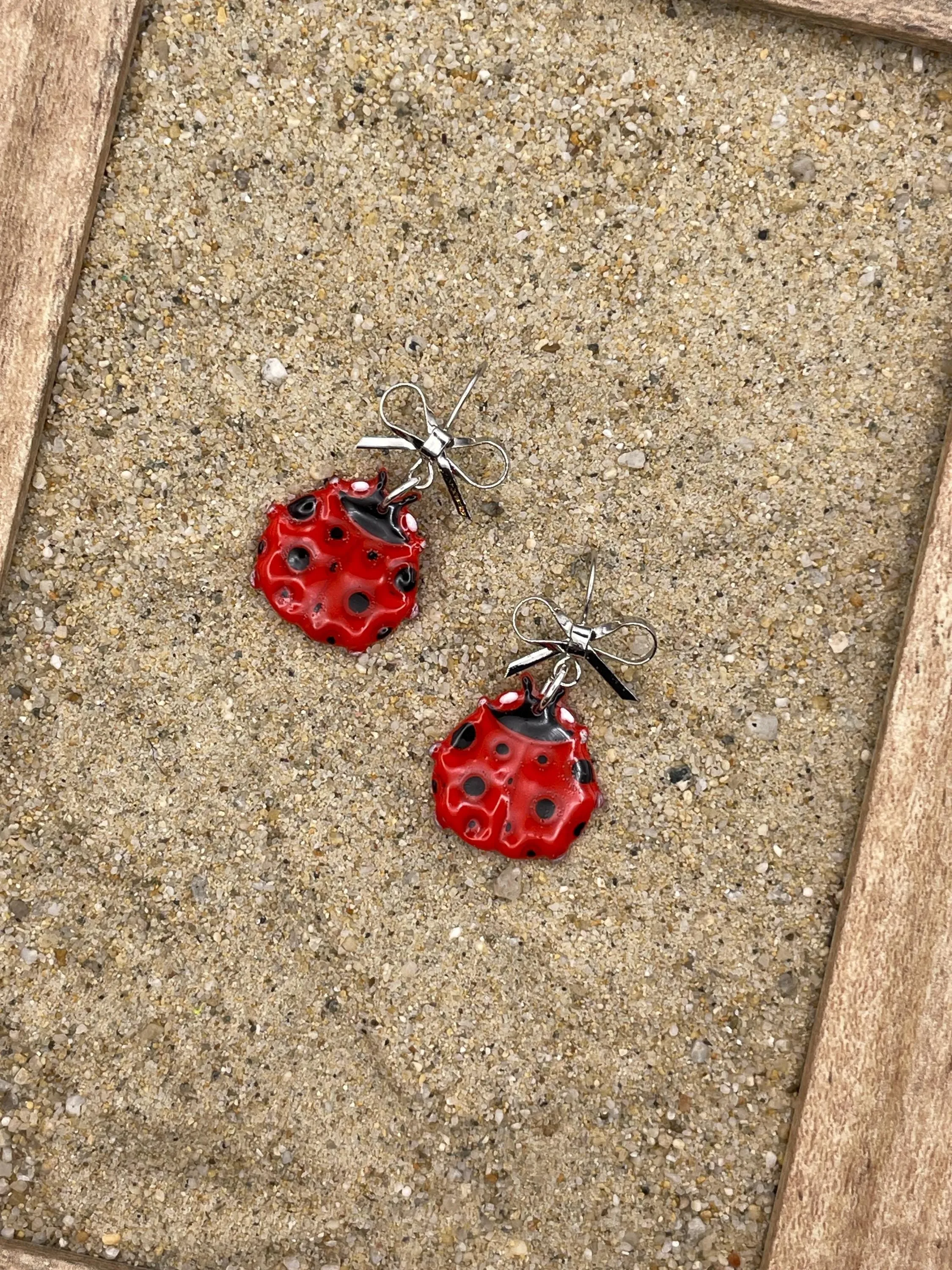 Lucky - Ladybug Earrings with Silver Bow Detail: Handmade Polymer Clay sold by Modcloth product image thumbnail 3