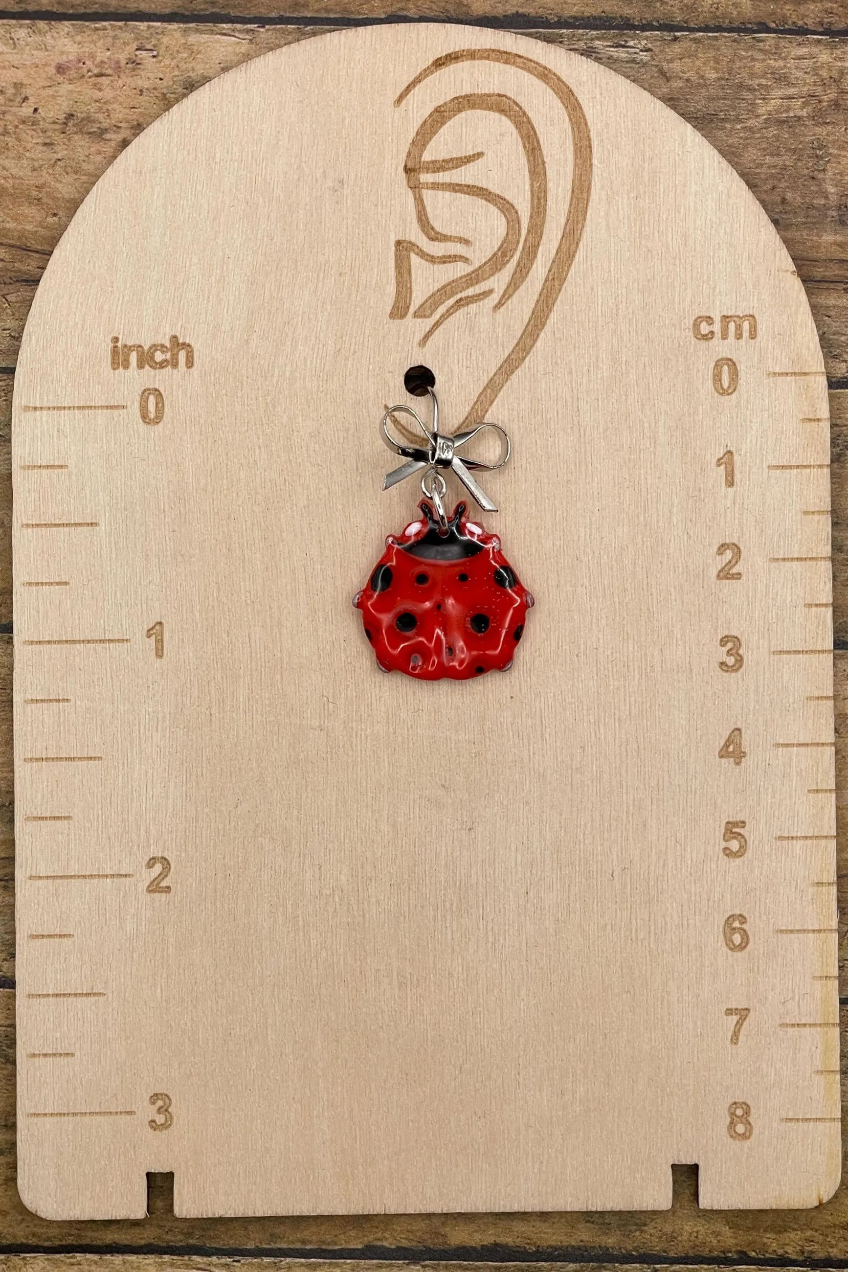 Lucky - Ladybug Earrings with Silver Bow Detail: Handmade Polymer Clay sold by Modcloth product image thumbnail 2