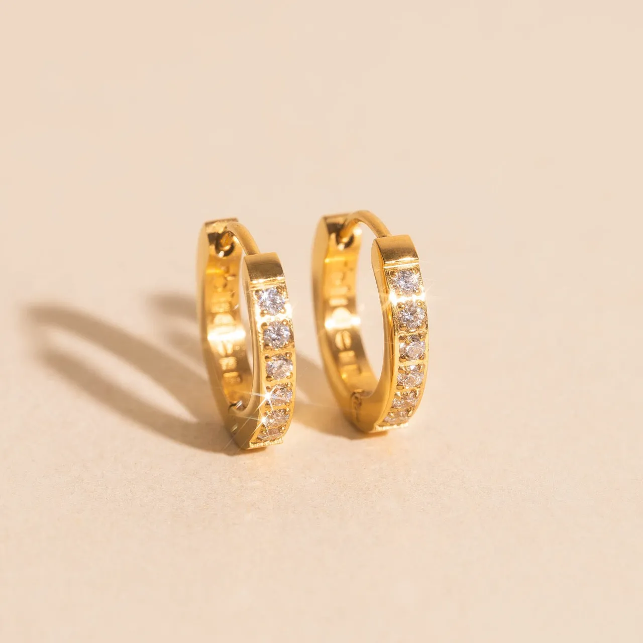 Crystal Huggie Hoop Earrings sold by Modcloth