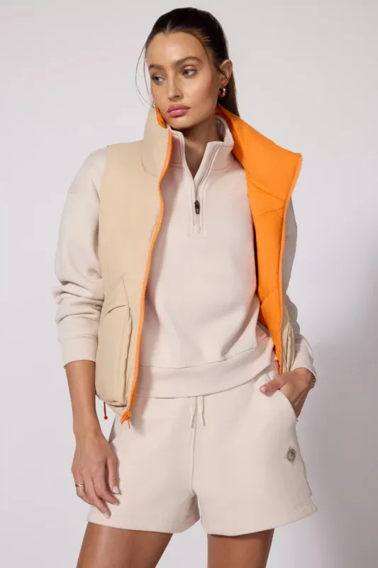 Captivate Reversible Vest - Irish Cream/Orange sold by MPG