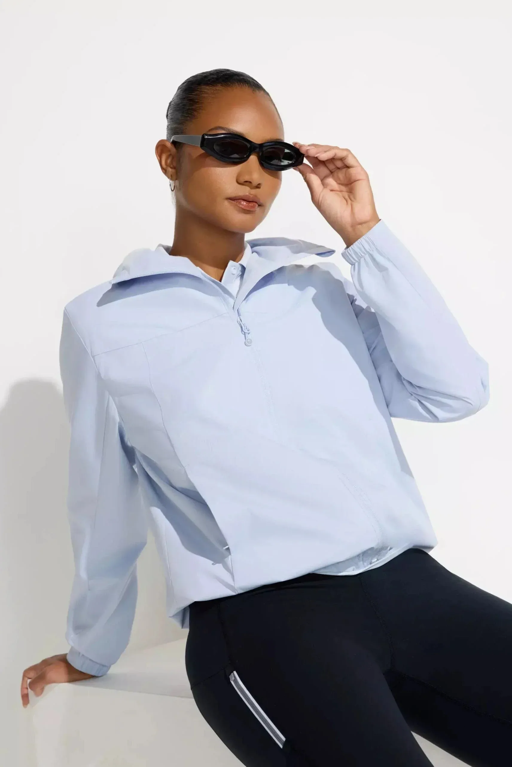 The Wind + Water-Resistant GRS Certified Poly Lined Rain Jacket - Halogen Blue sold by Mondetta