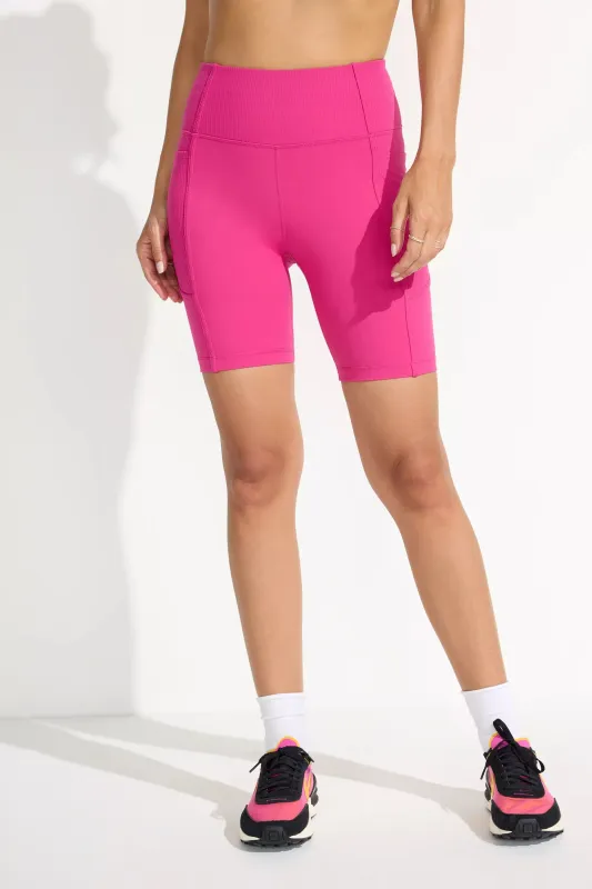 The Active Ribbed GRS Certified Recycled Nylon Biker Short - Hot Pink sold by Mondetta