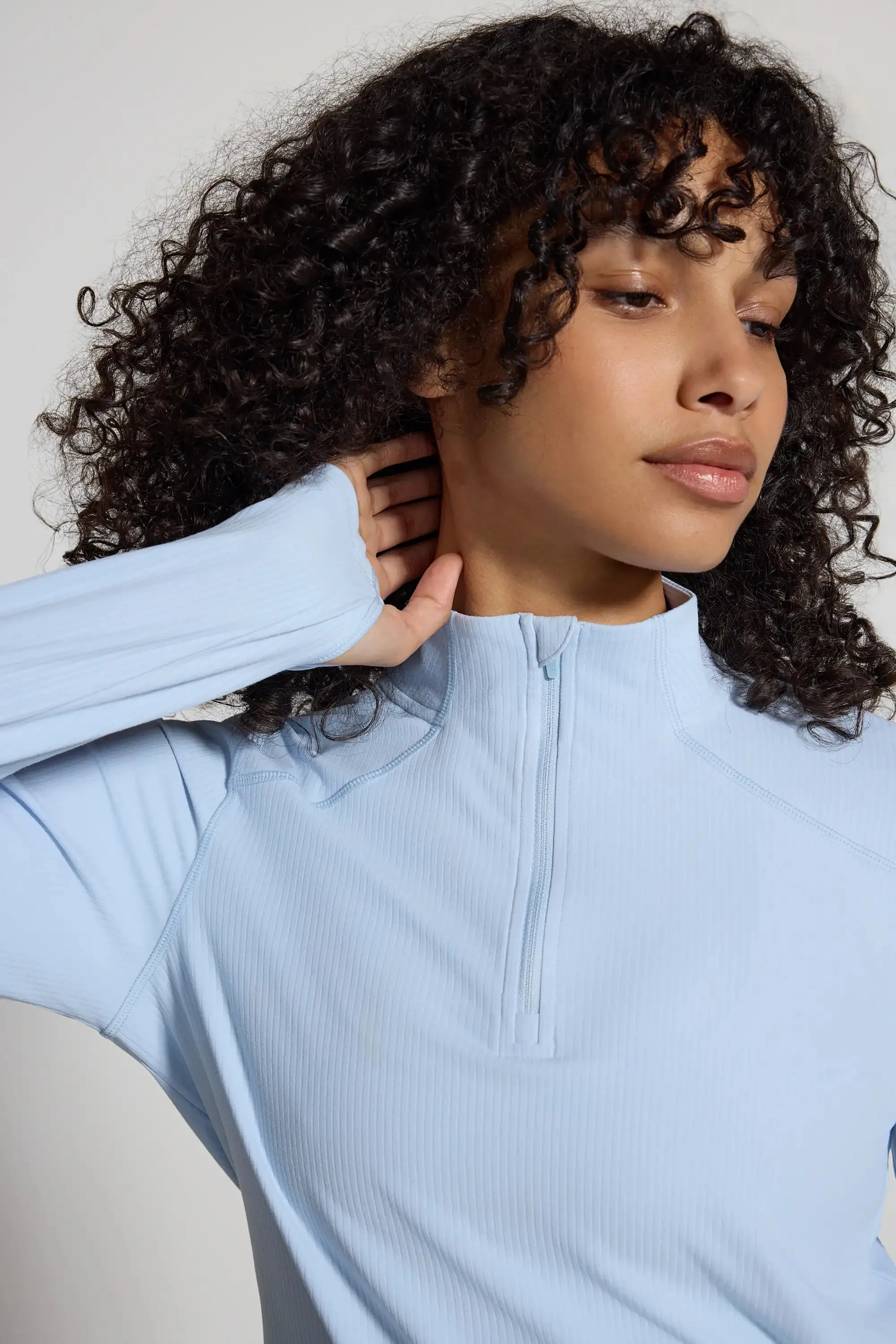 The Active Ribbed GRS Certified Recycled Nylon 1/2 Zip - Light Blue sold by Mondetta