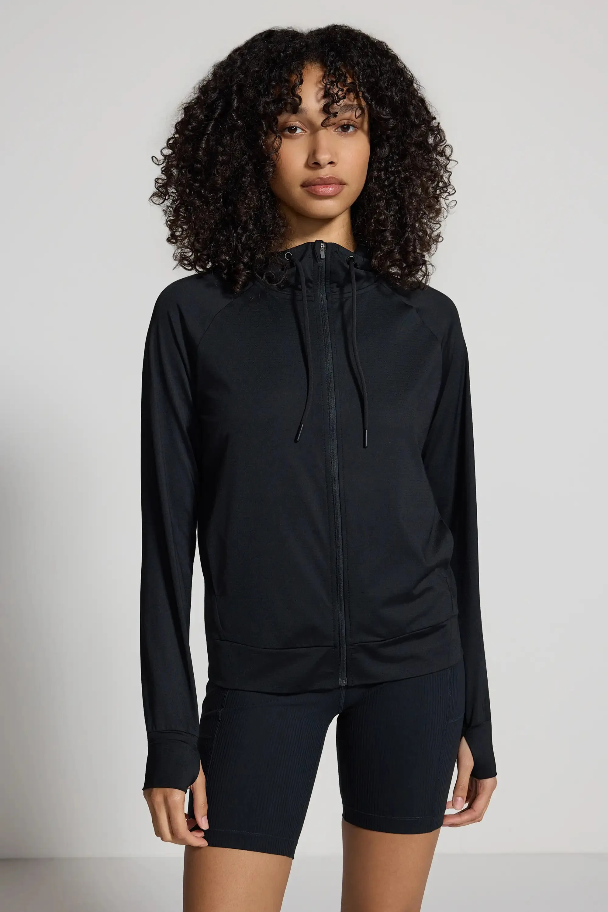 The Ultra-Light GRS Certified Recycled Nylon Full Zip Hoodie - Black sold by Mondetta