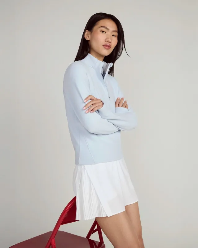 The Tennis + Golf  GRS Certified Recycled Poly Side Pleat Skort - White sold by Mondetta