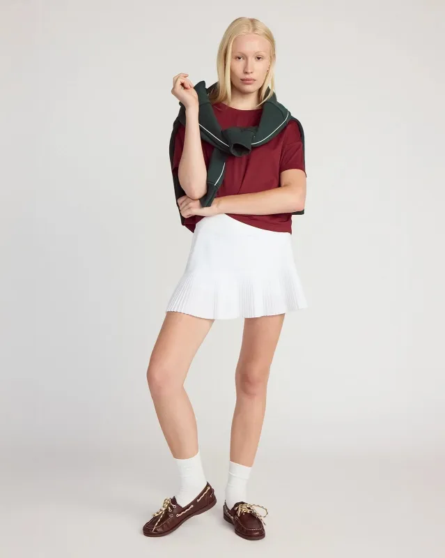 The Pleated Built-In Liner GRS Certified Recycled Poly Skort - White sold by Mondetta