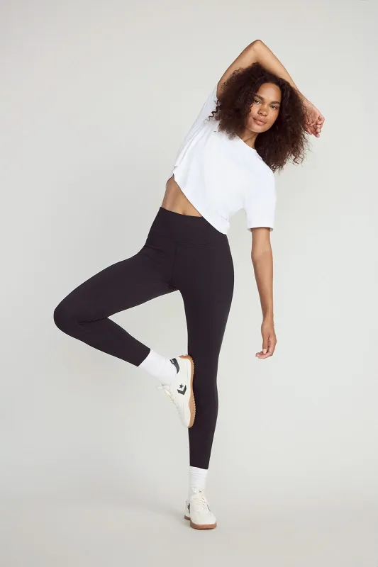 The Active Stretch GRS Certified Recycled Nylon Piping Detail Legging - Black sold by Mondetta