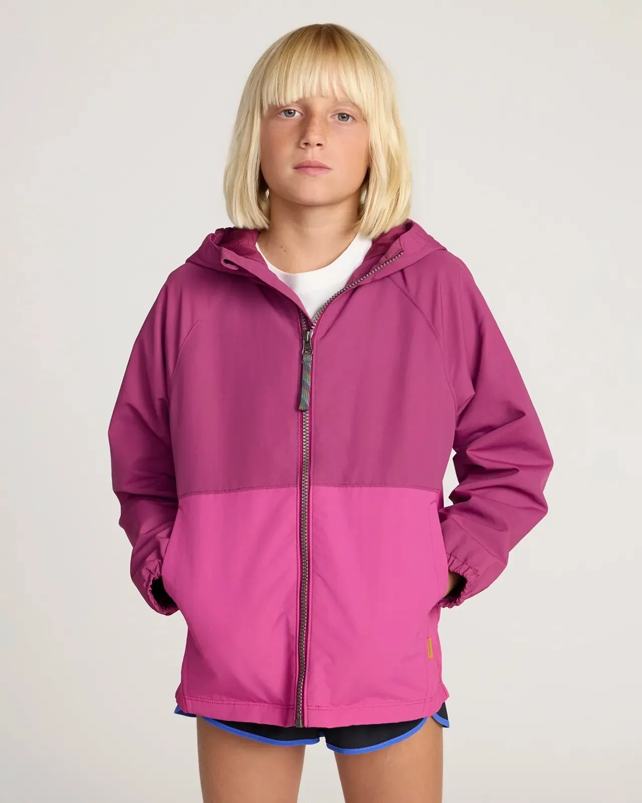 The Kids' GRS Certified Recycled Nylon Colour-Block Rain Jacket - Pink/Pink sold by Mondetta