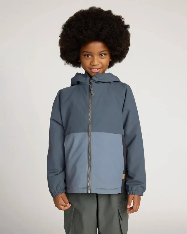 The Kids' GRS Certified Recycled Nylon Colour-Block Rain Jacket - Black/Grey sold by Mondetta