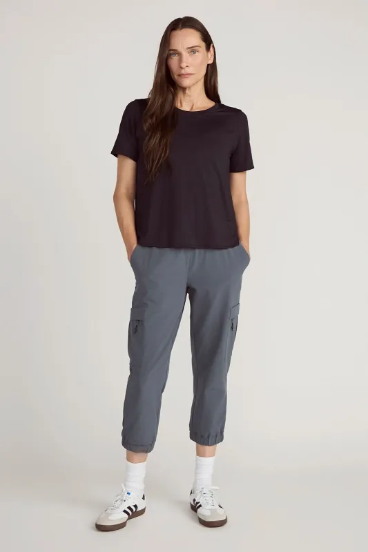 The Active Stretch GRS Certified Recycled Nylon Side Slits Tee - Black sold by Mondetta