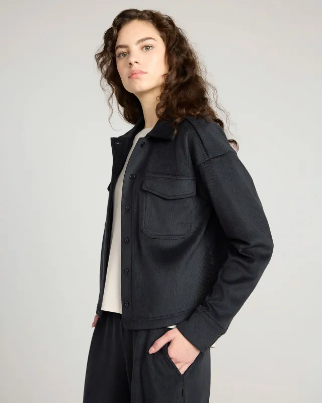 The Warm Stretch GRS Certified Recycled Poly Cropped Corduroy Shirt - Black sold by Mondetta