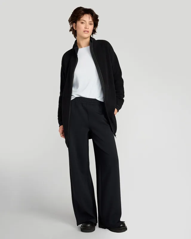 The Berber Soft Luxe GRS Certified Recycled Poly Longline Jacket - Black sold by Mondetta