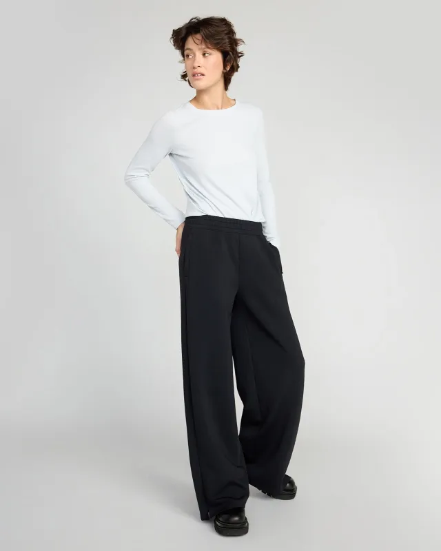 The Soft Stretch GRS Certified Recycled Poly Wide Leg Pant - Black sold by Mondetta