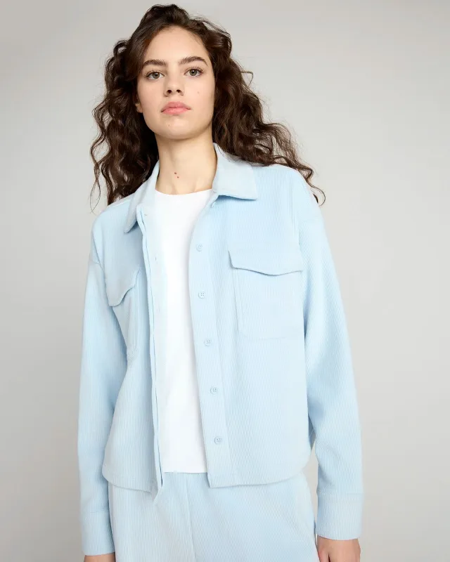 The Warm Stretch GRS Certified Recycled Poly Cropped Corduroy Shirt - Light Blue sold by Mondetta