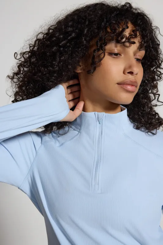 The Active Ribbed GRS Certified Recycled Nylon 1/2 Zip - Light Blue sold by Mondetta