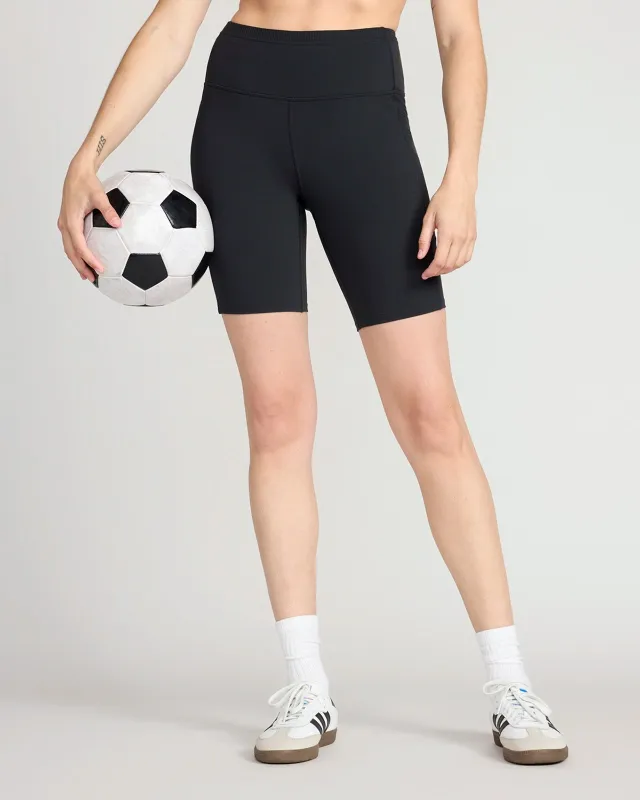 The Active GRS Recycled Nylon Curved Seams Biker Short - Black sold by Mondetta