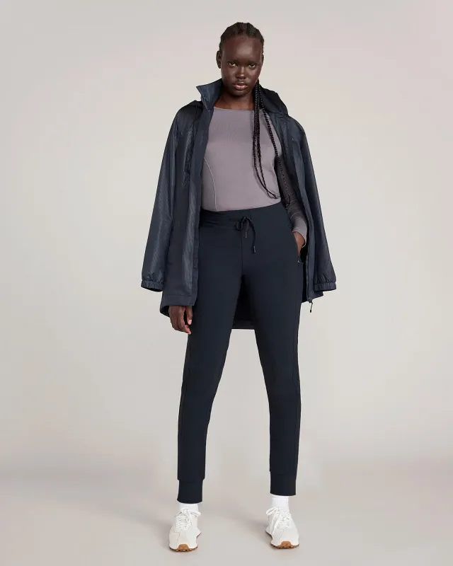 The Soft Stretch GRS Certified Recycled Nylon Carrot Leg Jogger - Black made by Mondetta