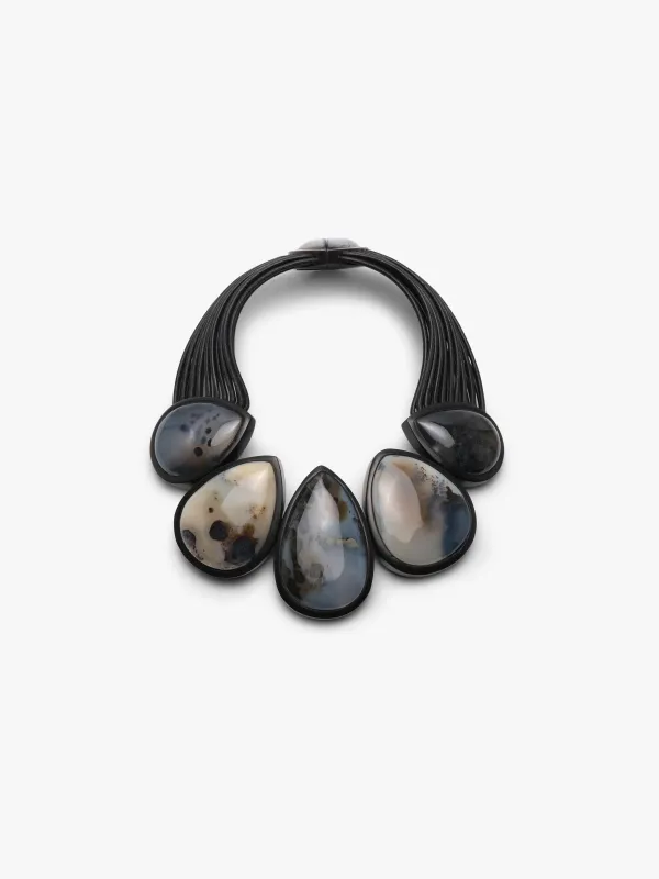 Necklace: dendritic agate, ebony, leather sold by Monies