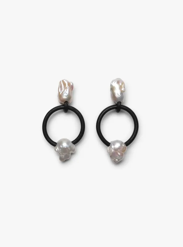 Roche earrings: baroque pearls, leather hoop sold by Monies