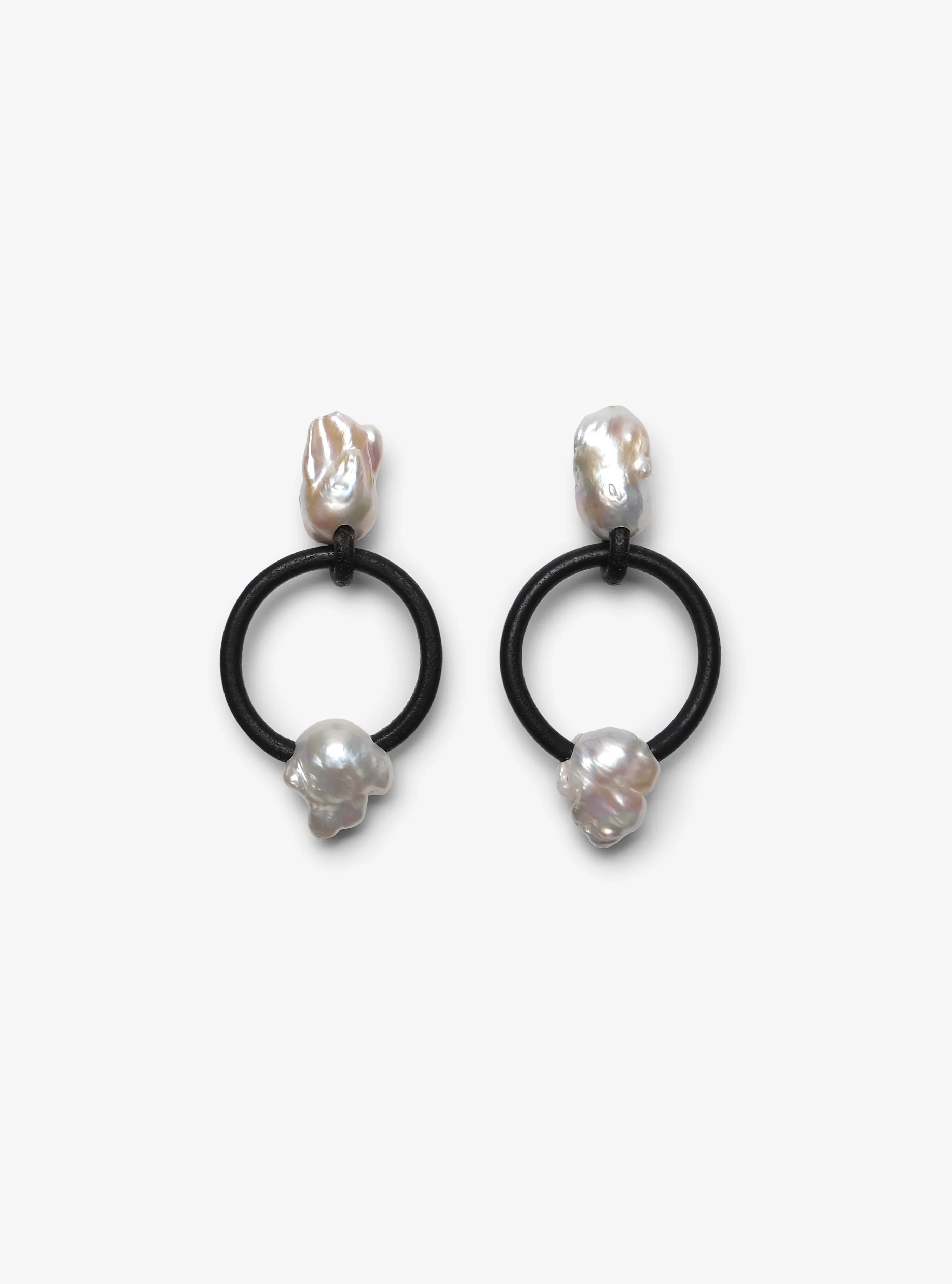 Roche earrings: baroque pearls, leather hoop sold by Monies