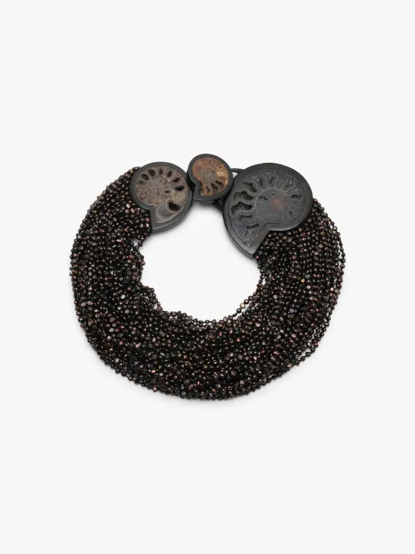 Necklace: amonite, ebony, pearls, leather sold by Monies