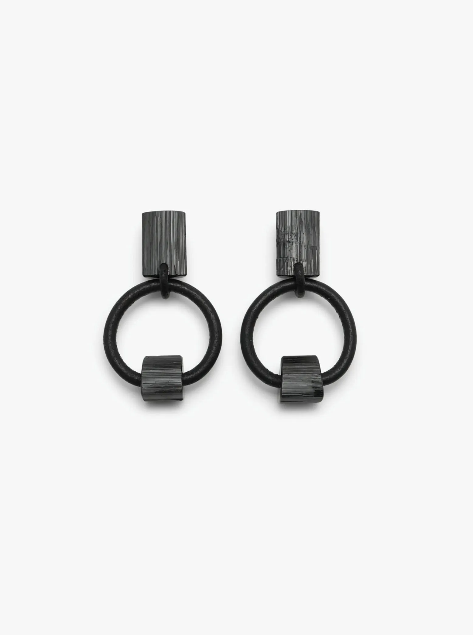 Jointure earclips: black tourmaline, leather sold by Monies