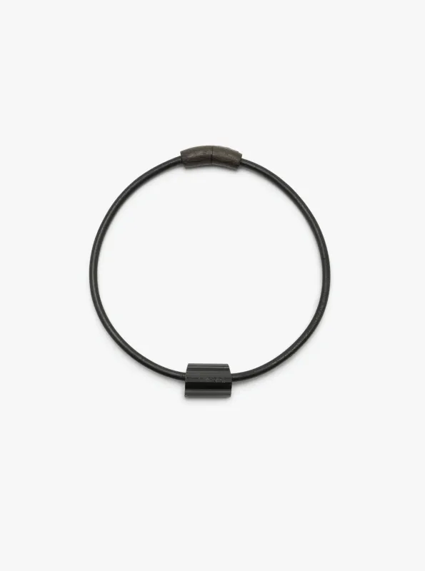 Mint necklace: leather, bog oak, tourmaline sold by Monies