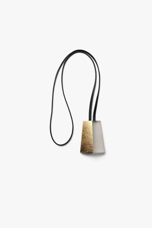Pendant in acrylic, leather and goldfoil sold by Monies