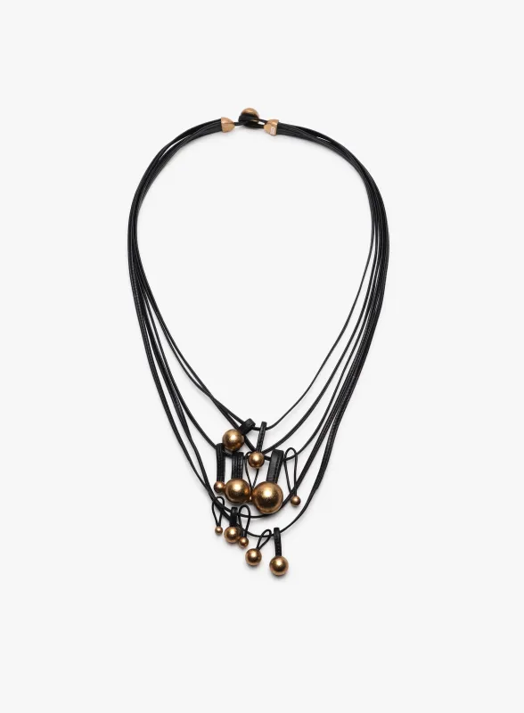 Domu necklace: leather, goldfoil sold by Monies