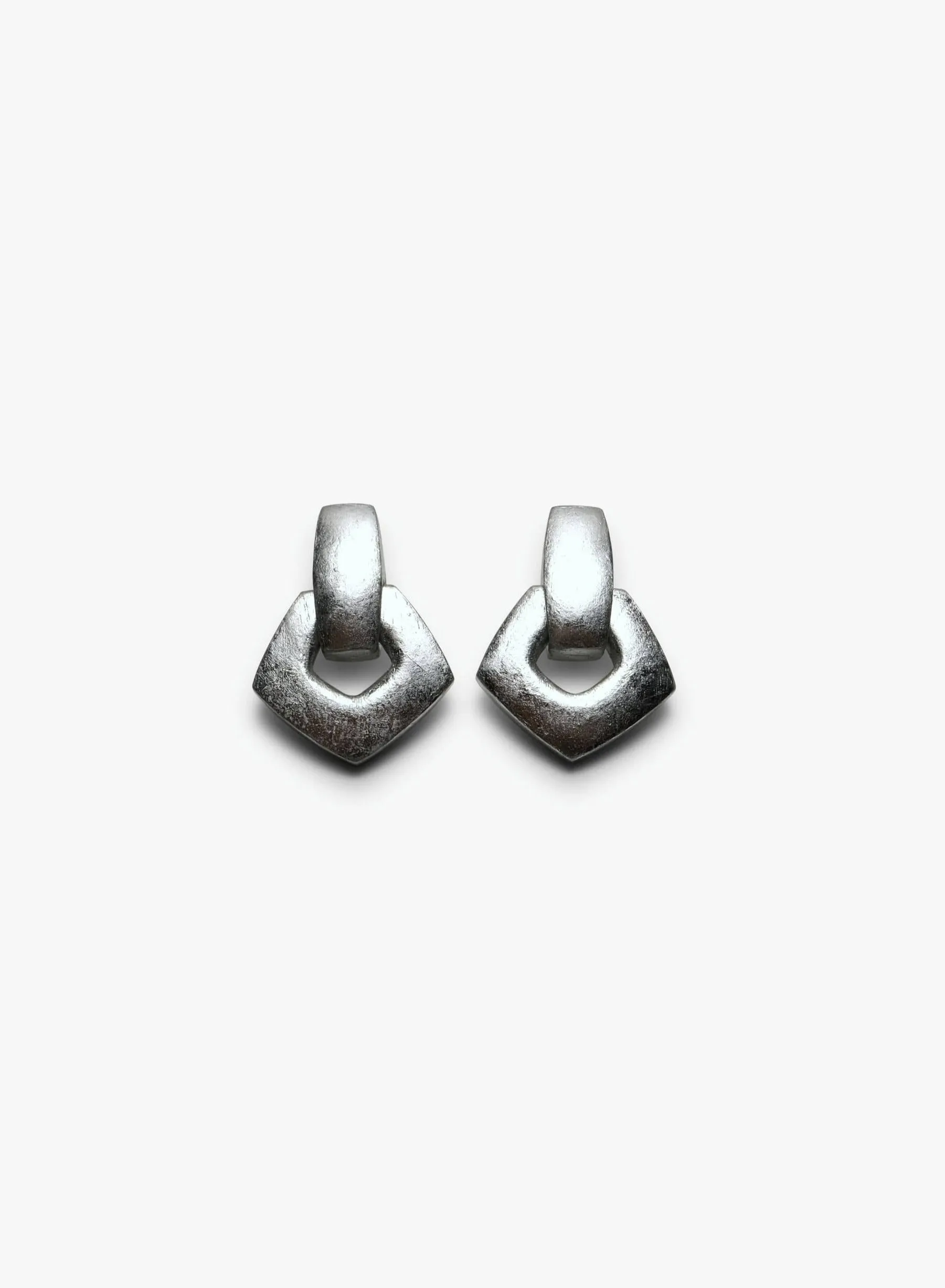 Moris earclips; acacia, silverfoil sold by Monies