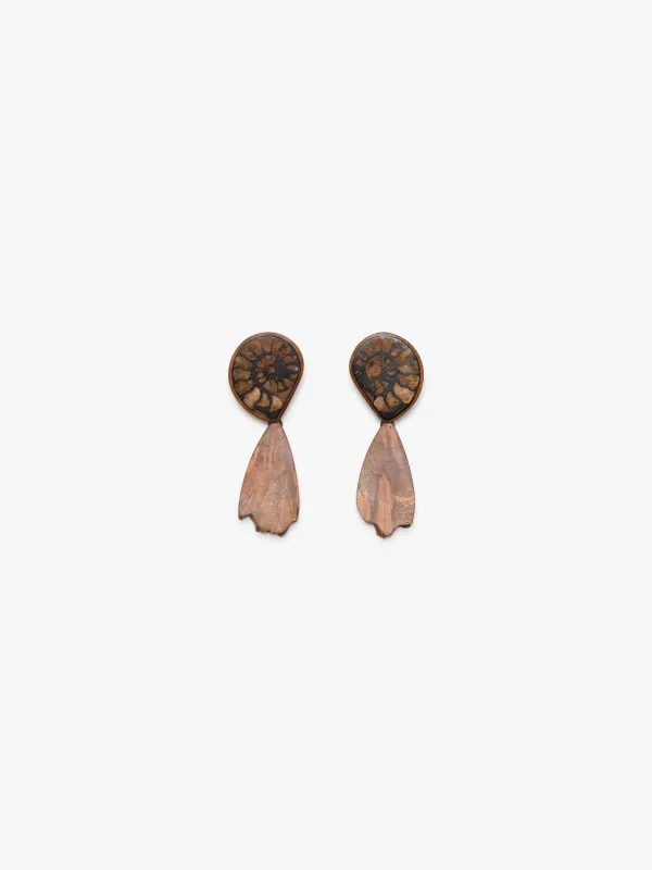 Earrings: ammonite, briar root sold by Monies