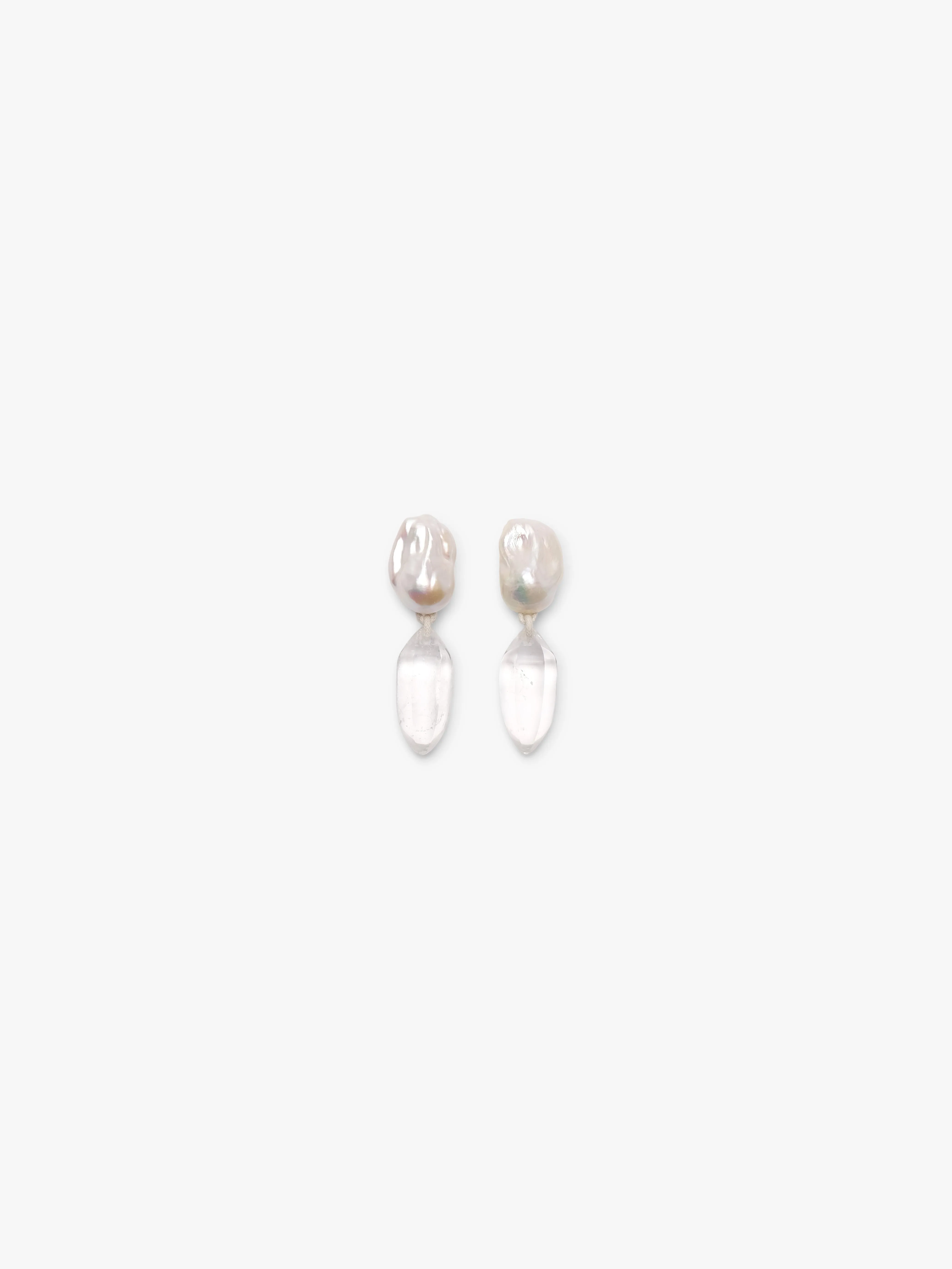 Earrings: mountain crystal, baroque pearls sold by Monies