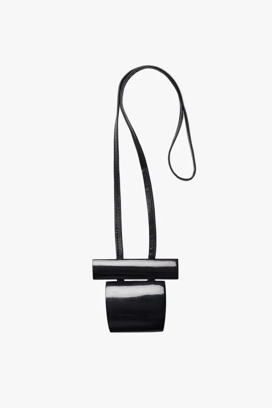 Pendant: black horn, leather sold by Monies