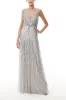 Shimmering Silver Tulle Gown sold by Monique Lhuillier