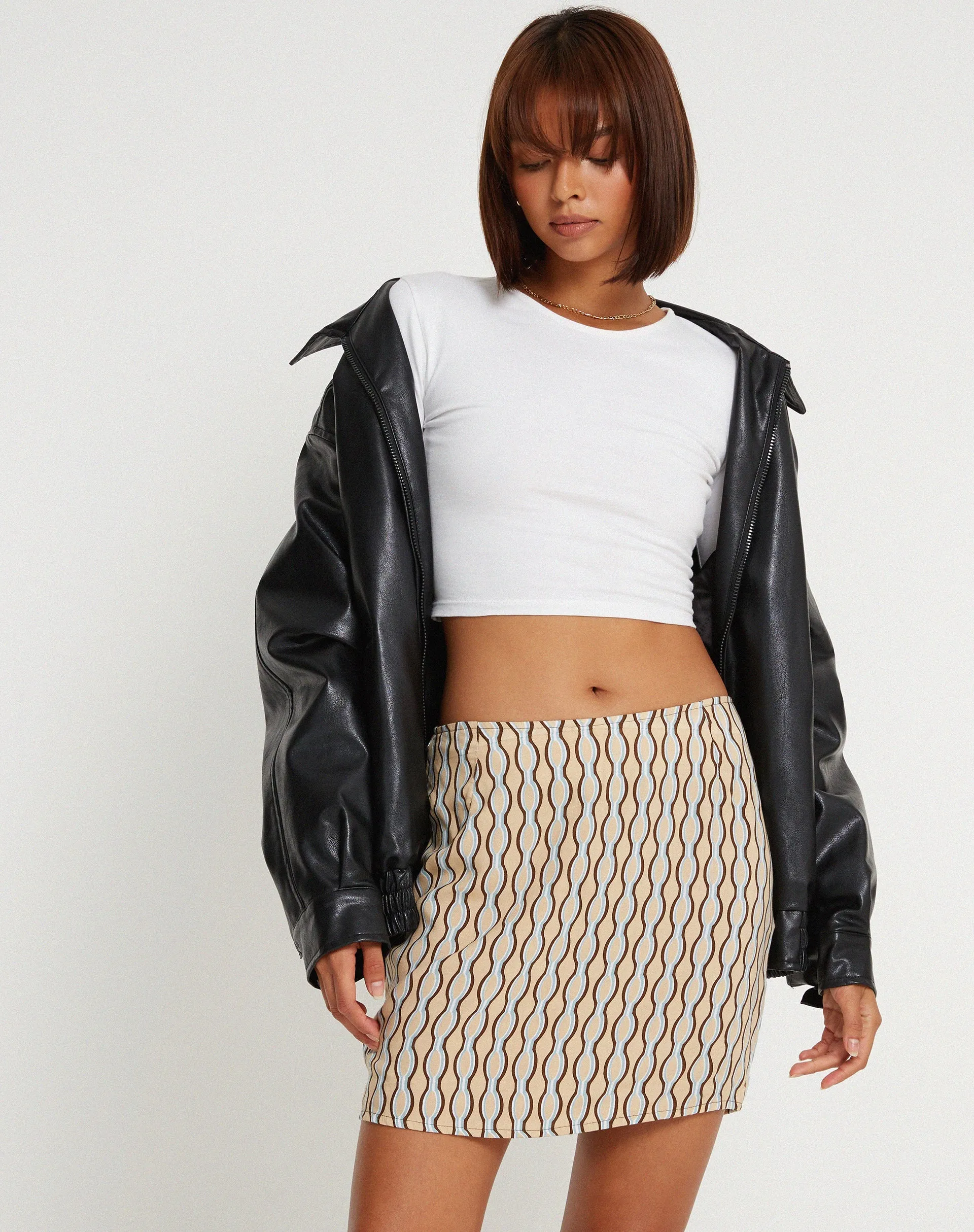 Pelmo Mini Skirt in Preppy Geo Brown sold by Motel Rocks