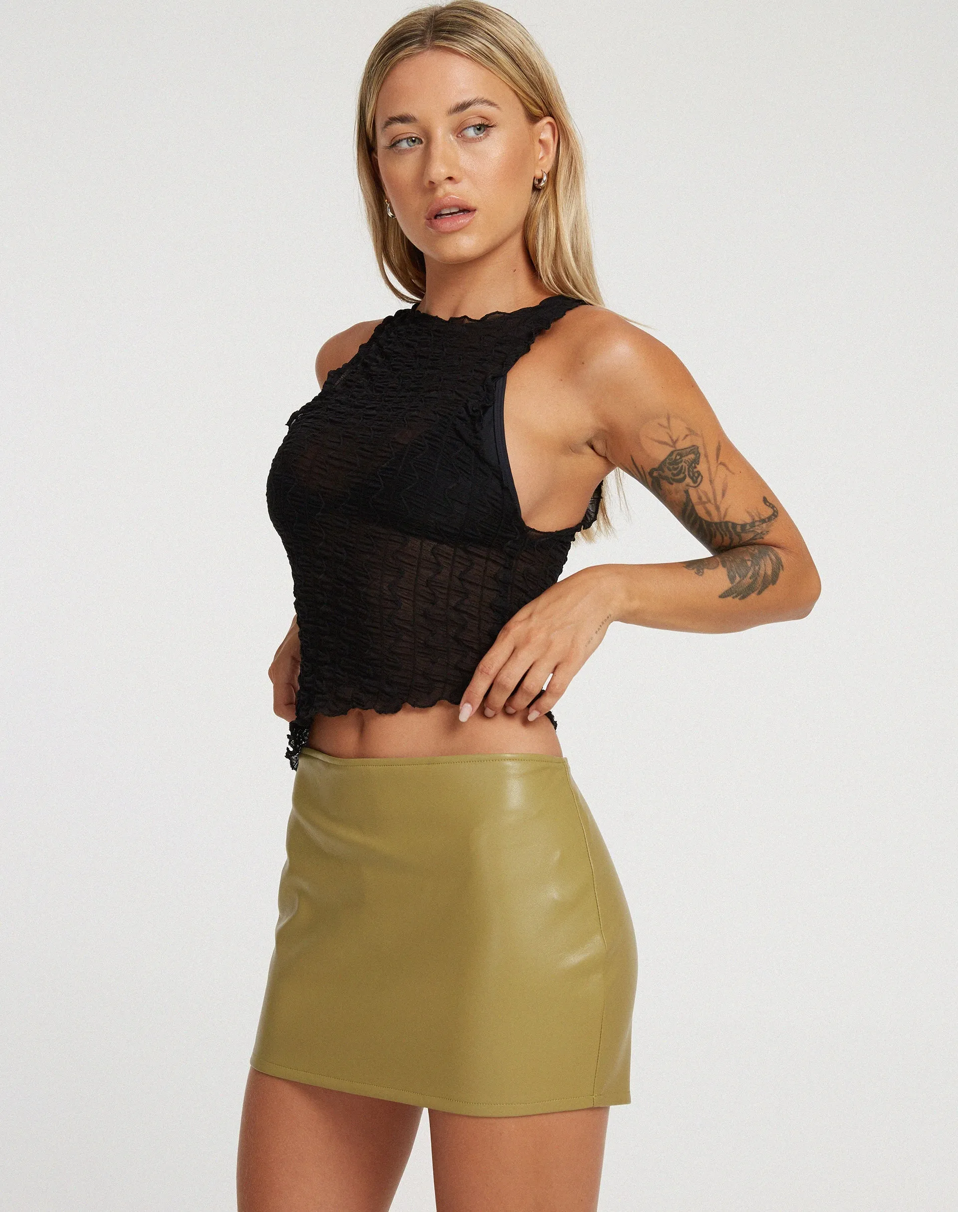 Ima Mini Skirt in PU Leaf Green sold by Motel Rocks