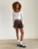 Carlita Pleated Mini Skirt with Bow in Light Brown sold by Motel Rocks